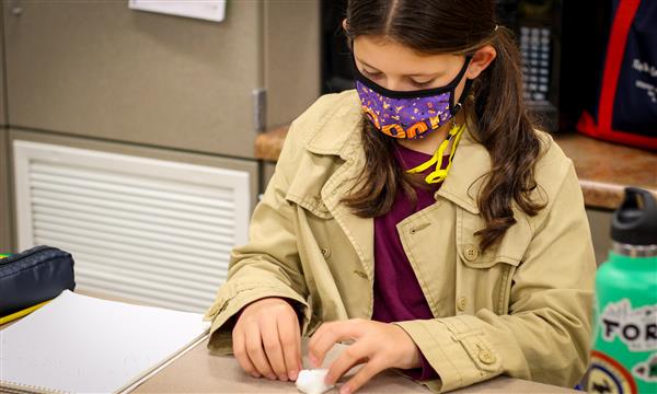 Student works on food model